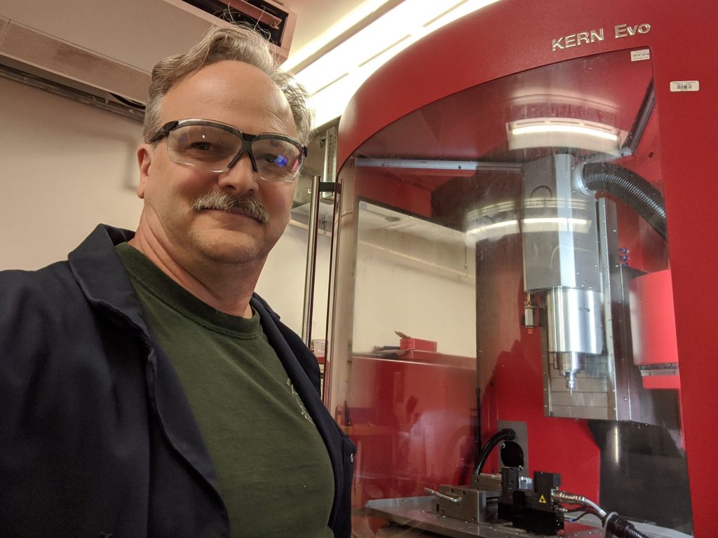 Greg Nuspel from NRC with a Kern CNC mill in the shop